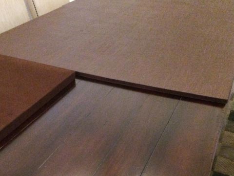 Rectangular table pad photo with section folded for storage