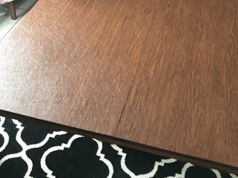 Light cherry wood dining table protector pad