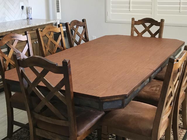 Dining table protector pad with clipped corners