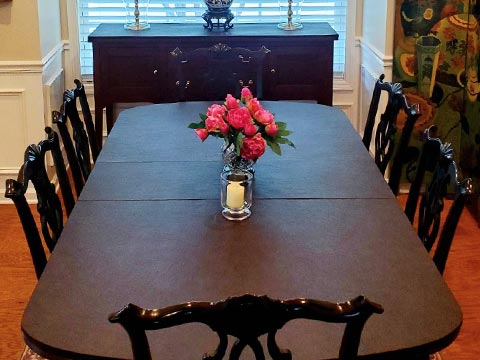 Round-ended dining table protector pad with matching buffet/sideboard