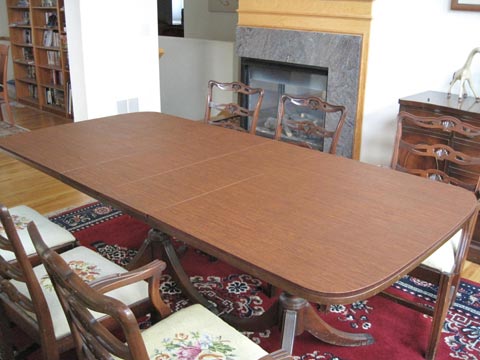 Dining table protector pad with rounded ends, in cherry woodgrain